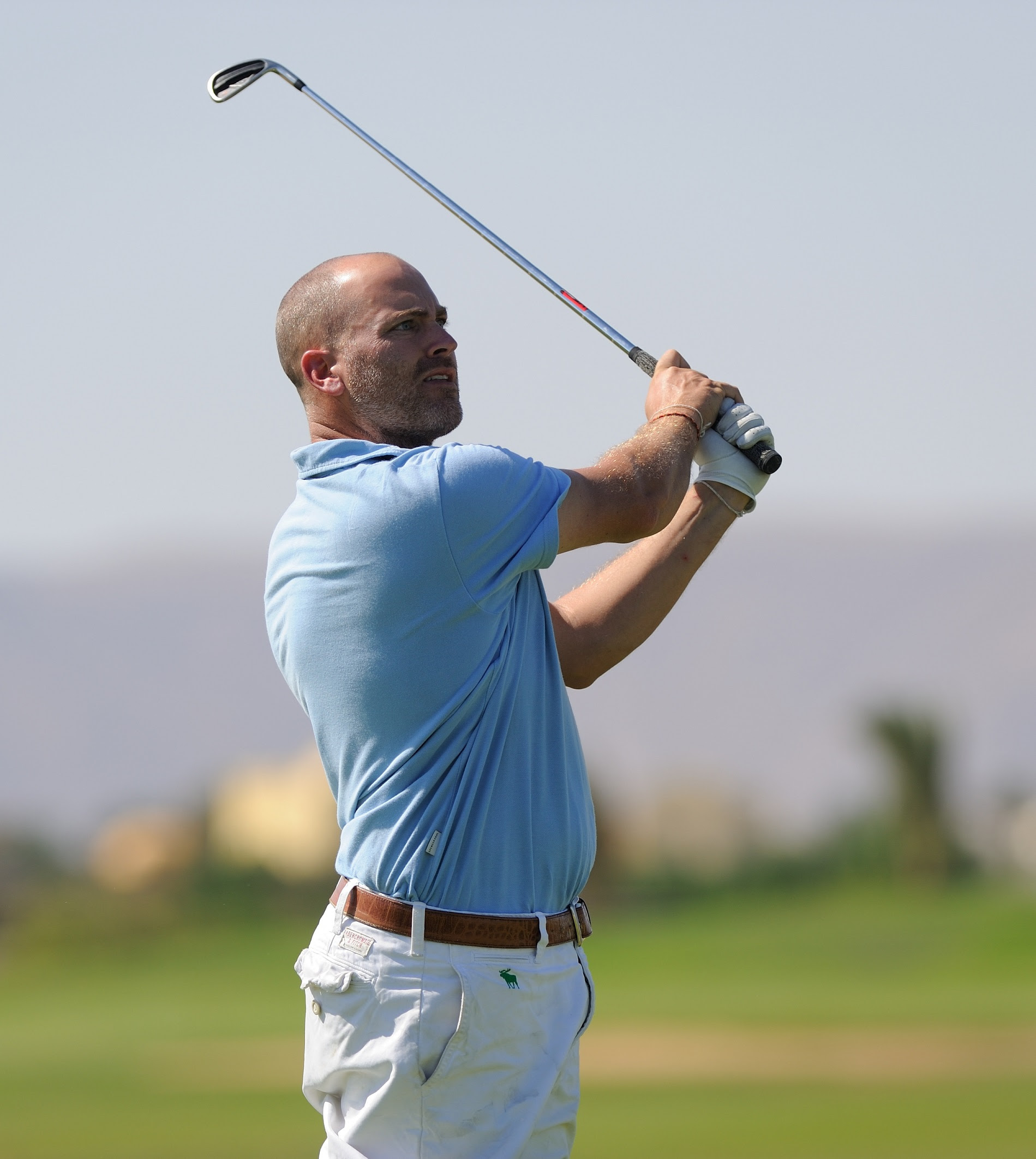 Improve your golf swing with John E. Bon Vivant