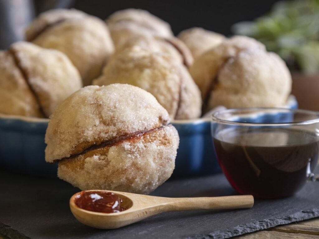 Beso or yoyo, a typical Mexican sweet bread covered in butter and sugar and filled with jam or cajeta