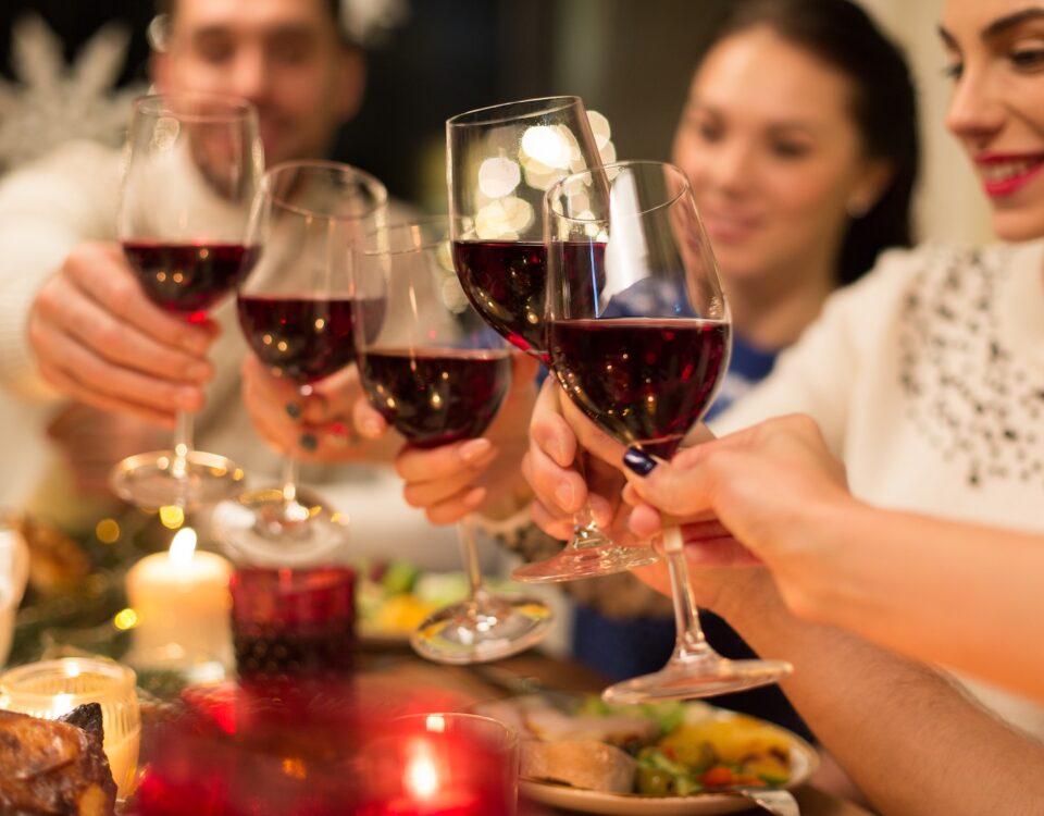 A group of friends enjoying a Christmas dinner and wine pairing